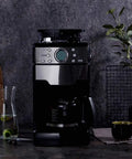 No Sweat Bean To Cup Coffee Maker With Fully Automatic One Button Brew featuring stainless steel body and glass carafe.