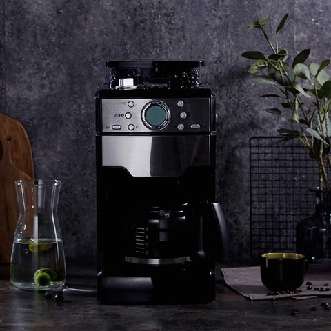 No Sweat Bean To Cup Coffee Maker With Fully Automatic One Button Brew featuring stainless steel body and glass carafe.