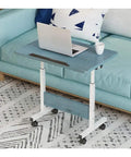 Height Adjustable Rolling Laptop Desk With Smooth Caster Wheels Mobile Workstation Table For Sofa Bed Or Remote Office with laptop and coffee.