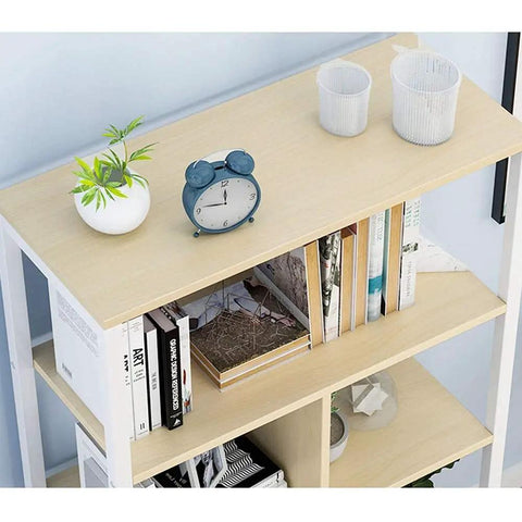 Five Tier Industrial Bookcase Walnut Storage Rack With Hefty Open Shelves displaying books, plants, and decor on a cream shelf.