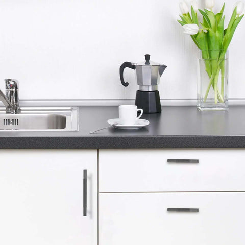 10 Pack 5 Inch Knurled Cabinet Pulls Matte Black Drawer Handles on a modern kitchen cabinet with a coffee setup.