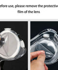 Close-up of lens protective film removal from Kids Safety Goggles 8 Pack Adjustable Lightweight Protective Glasses.