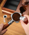 Hands using Espresso Distribution Tool With 10 Needle 0.35mm Precision Stirrer for Even Extraction on portafilter