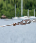 316 Stainless Steel Shoulder Eye Bolt Set Half Inch By Four Inch Marine Grade Eyebolts with Nuts installed outdoors