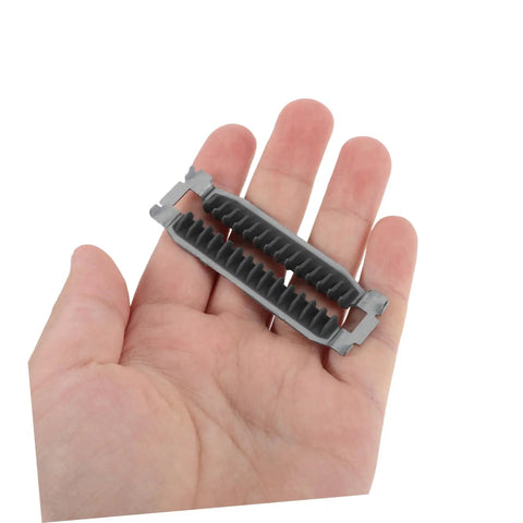 Automatic Tape Cutter Guide Plate Replacement For Metal Tape Machines Easy Install Spare Part For Warehouse And Packaging Prevents Jams Pro Grade Boosts Packing Line Productivity And Workflow, small gray plastic part in hand
