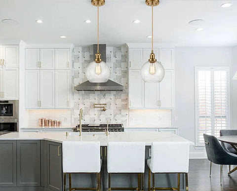 Modern Brass Seeded Glass Pendant Light With Dimmable Hanging Fixture Handblown Clear Glass Shade With Tiny Bubbles Warm Brass Finish And Braided Cord For Kitchen Island Or Dining Area illuminating a contemporary kitchen island