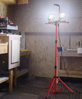 Daylight Bright Dual Head LED Work Light With Adjustable Foldable Tripod Stand 5000 Lumen 5000K in workshop setting