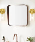 Brushed Gold Wall Sconces Set Of Two With Clear Glass Shades, Modern Brass Vanity Lights For Bathroom next to a square mirror