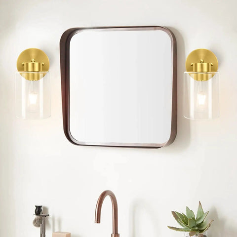 Brushed Gold Wall Sconces Set Of Two With Clear Glass Shades, Modern Brass Vanity Lights For Bathroom next to a square mirror