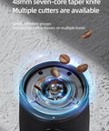 Close-up of 48mm seven-core taper knife in Compact Portable Electric Coffee Grinder with coffee beans above.