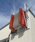 Electric Attic Stairs With Remote Control Wall Mounted Retractable Step Ladder Built Like A Tank Non Slip Pedals mounted on wall.