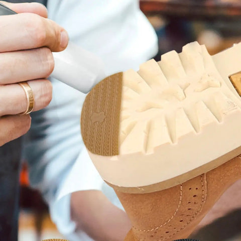Person applying Polyurethane Shoe Heel Repair Pads Half Round Sole Protectors For Sneakers on shoe sole.