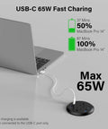 Sleek Flush Mount Power Grommet Featuring Four Standard Outlets And Four USB C Fast Charging Ports For Your Next Big Boss Setup and Countertop Organization Game Changer For Modern Home Office Black Dual Sided Design Six Foot Cord charging a MacBook Pro.