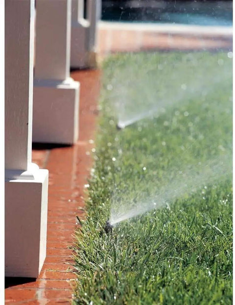 High Efficiency PRS Pop Up Sprinkler 1802HV15PR With 0 To 360 Degree Adjustable Coverage watering grass along a walkway