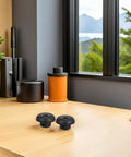 Beefed Up 4 Pack Drive Socket Replacement Part For Soy Milk Makers And Smoothie Blenders Black Plastic Coupler With Quick Install And Serious Blending Power For Your Kitchen. two black replacement drive sockets on a desk