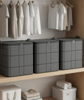 Heavy Duty Nonwoven Storage Bins Three Pack With Sturdy Handles, spacious grey organizers on wooden shelf in closet.