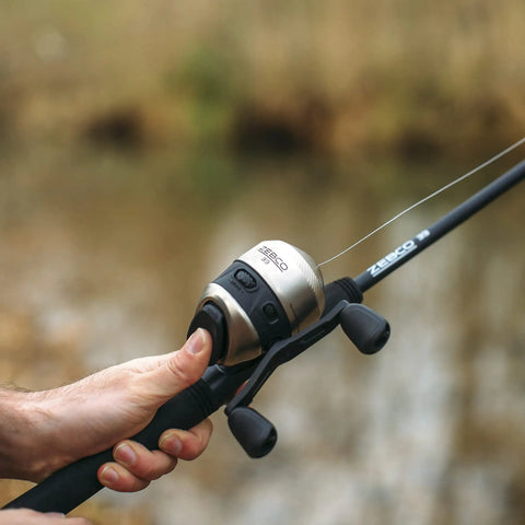 Close-up of Go-To Spincast Reel And Telescopic Fishing Rod Combo With Extendable 22.5-Inch To 6-Foot E-Glass Pole Size 30 Reel in use