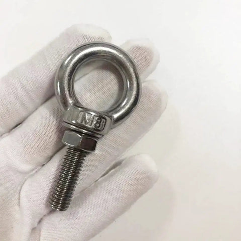 Heavy Duty Stainless Steel Shoulder Eye Bolts 4 Pack M8 Eyebolt Set With Nuts And Washers 5 16 Inch By 1.18 Inch Lifting Rings Built For Secure Load Handling And Rugged Quick Hookups 30mm Thread Length, M8 stainless steel eye bolt with nut and washer in hand