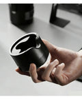 Adjustable Espresso Tamping Station For Home Cafe Setups Fits 51mm 53mm And 58mm Portafilters shown in hand.