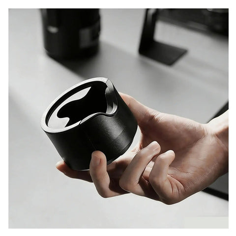 Adjustable Espresso Tamping Station For Home Cafe Setups Fits 51mm 53mm And 58mm Portafilters shown in hand.