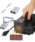 24V 20A Fully Automatic Forklift Battery Charger With Smart 4-Stage Charging, LCD Display, 7 Protections, cables, hand holding.