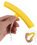 Hand holding yellow 5 Pack Rim Protectors For Tire Changing Universal Wheel Guards And Rim Protectors For Tire Machines Pro Grade Durable TPE Rim Saver For Changing Tires Yellow For Easy Tire Changes