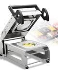 Hmkd Qbd Commercial Food Tray Heat Sealer Machine with open lid showcasing a food container for sealing takeaway boxes.