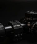 Close-up of Two Piece Picatinny Scope Rings With Anti Cant Indicator For Leveling And Precision Shooting mounted on a rifle scope.