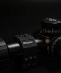 Hella Secure 2 Piece Picatinny Scope Rings With Built In Anti Cant Leveling Dial And Flat Top Base on scope, showcasing precision engineering.