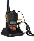 UV-6R Ham Radio Handheld 5W Walkie Talkie For Adults in charging dock with earpiece attachment, dual band display visible