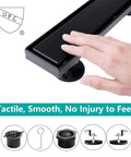 Hand touching 24 Inch Matte Black Linear Shower Drain With Hair Catcher And Leveling Feet, rectangle tile insert, 304 steel.