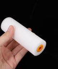10 Pack High Density Foam Paint Roller Covers for Walls Ceilings Cabinets and Doors Achieve a Hella Smooth Finish on Flat Surfaces with Multi Purpose Replacement Roller Sleeve held in hand.