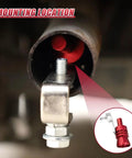 Red YoRise exhaust whistle installed inside car tail pipe with mounting bolt and clamp.
