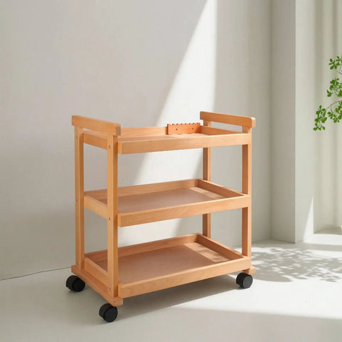 Sturdy Beech Wood Rolling Art Supply Cart With Wide Three Tier Shelves Secure Side Guards And Silky Smooth Wheels in a bright studio.
