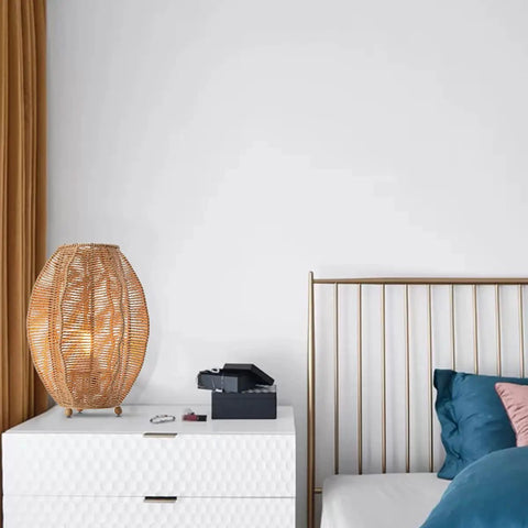 Rattan Woven Side Table Lamp For Boho Coastal Living Room And Bedroom Handmade Farmhouse Nightstand Lamp on a white dresser