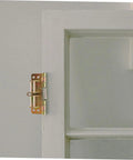 Heavy duty cabinet hinges on a white wooden door for durability and smooth operation.