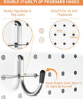 Close-up of a 1/4 inch pegboard with a mounted hook from the Heavy Duty Pegboard Hook Kit With 170 Pieces For One Quarter Inch Pegboards