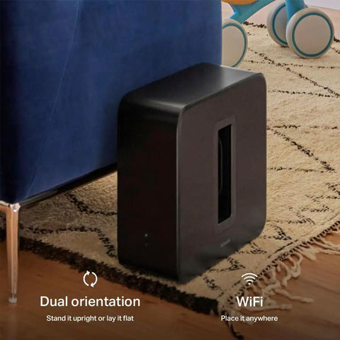 Dope Deep Bass Wireless Subwoofer For Immersive Home Theater With Ported Enclosure next to couch, dual orientation options shown