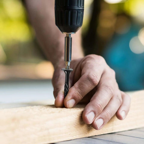 Person installing Heavy Duty Outdoor Deck Screws 14 By 2 And A Half Inch, 44 Pack, Black Epoxy Coated using a drill on wood