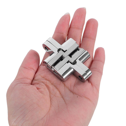 Concealed 43mm Zinc Alloy Hinges Set for Jewelry Boxes and Cabinets held in hand, showing four-piece cross folding hidden design