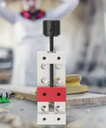 Slick Compact Mini Vise With 50mm Jaw Space, close-up view showing the red alloy frame and screw mechanism for secure clamping.