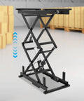 Heavy Duty Electric Scissor Lift Table Rises Smooth With Hydraulic Pump For Factory Work and Warehouse lifting, black metal structure featured.