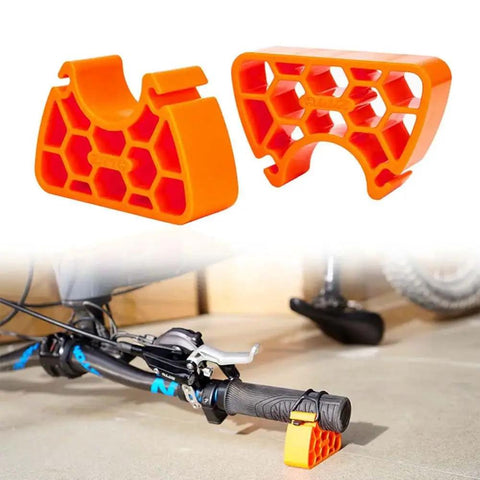Two Pack Portable Bike Repair Stand With Upside Down Handlebar Holder Height Adjustable Feet Ideal For MTB Gravel Hybrid And Ebike Maintenance Tire Changes Wheel Adjustments And Brake Work showing orange stands holding handlebar.