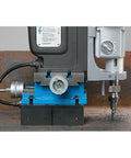 Rock Solid Workhorse Portable Magnetic Mill Drill With Adjustable Base Variable Speed Four Gear Drive Reversible Motor and Power Assist for Flawless Shop Floor Work on a steel surface.