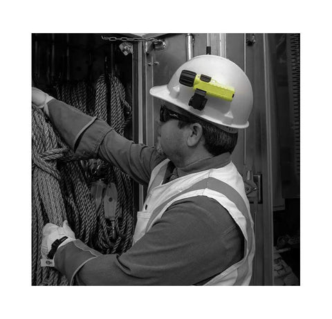 Worker with a Yellow Waterproof LED Flashlight With Tail Switch on helmet, showcasing outdoor utility use.