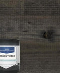 Pro Grade Reactive Water Based Wood Stain For Interior Or Exterior Creates A Badass Smoked Black Brown Finish With Real Deal Charred Rustic Appeal That Bonds Deep Through Natural Tannins Delivering Top Notch Architectural Depth In A Heavy Duty Fifty Five in a can on wooden background.