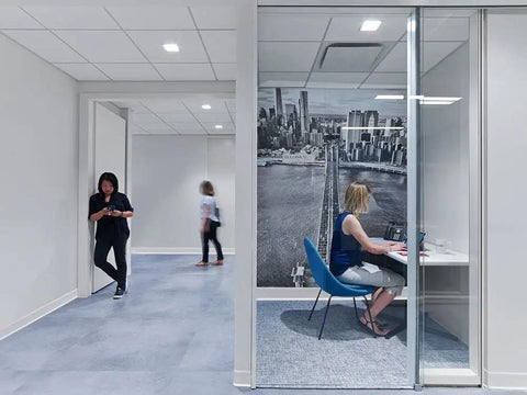 Office space with Non Glue Vinyl Wall Base Two And A Half Inch By Eighty Foot Durable Flexible Trim for walls and floors, woman working