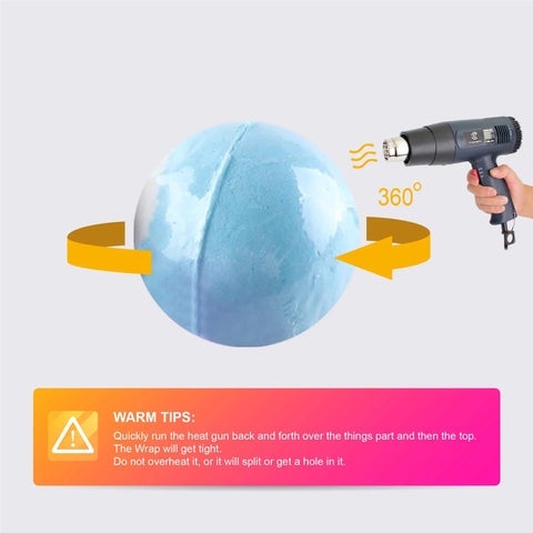 Heat gun shrinking Clear PVC Shrink Wrap Bags 4x6 Inches With Heat Seal 400 Pcs Pack on blue bath bomb with instructions.