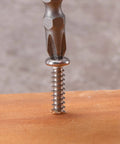 Pro Grade Number 6 X 1/2 Inch 304 Stainless Steel Wood Screws 100 Pack Pan Head Fasteners driven into wood.