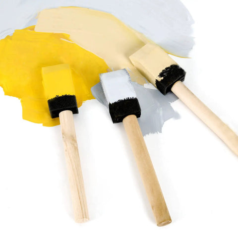 Kick Ass 1 Inch Foam Paint Brushes 12 Pack High Density Polyfoam Applicators For Mod Podge Wood Staining Wall Decor Awesome Household Cleanup Tasks Zero Hassle. Close-up of three foam brushes in yellow, white, and beige paint.